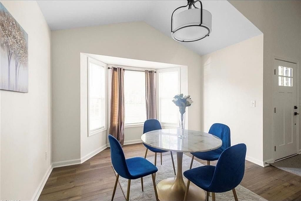 Dining area with bay window and staged table