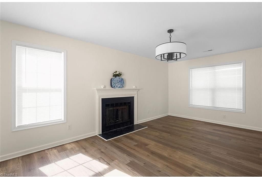 Family room with fireplace and new flooring